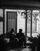 Young couple sitting on porch at night Poster Print - Item # VARSAL255419293
