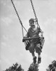 Low angle view of a boy swinging on a swing Poster Print - Item # VARSAL25512887