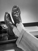 Man's feet on desk Poster Print - Item # VARSAL25549311