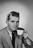 Young man drinking tea Poster Print - Item # VARSAL255421277 Young man drinking tea Poster Print - Item # VARSAL255421277