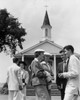 Group of people standing in front of church Poster Print - Item # VARSAL25543284