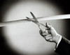 Person's hand cutting a ribbon with a pair of scissors Poster Print - Item # VARSAL2553748