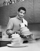 Portrait of a young man holding dishes Poster Print - Item # VARSAL25521665 Portrait of a young man holding dishes Poster Print - Item # VARSAL25521665