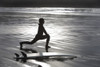 Surfer Stretching On Beach PosterPrint - Item # VARDPI1829337