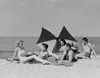 Young people relaxing at beach Poster Print - Item # VARSAL255422144