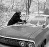 Men cleaning car from snow Poster Print - Item # VARSAL255416382