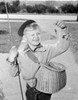 Boy holding fishing bait smiling Poster Print - Item # VARSAL255424536
