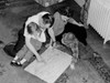 Parents with kids sitting on floor looking at map Poster Print - Item # VARSAL255422759