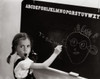 Side profile of a girl drawing a cartoon of her teacher on the blackboard Poster Print - Item # VARSAL2552139