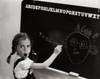 Side profile of a girl drawing a cartoon of her teacher on the blackboard Poster Print - Item # VARSAL2552139