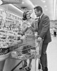 Mid adult couple shopping in a supermarket Poster Print - Item # VARSAL2556318B