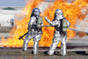 March 13, 2010 - Firefighters discuss options while training at an aircraft fire simulation at the Combat Readiness Training Center in Savannah, Georgia. The burn pit is a live fire training simulator Poster Print - Item # VARPSTSTK103475M