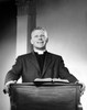 Priest standing at a lectern and preaching Poster Print - Item # VARSAL25543272