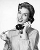 Portrait of a young woman talking on the telephone Poster Print - Item # VARSAL25544469