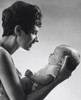 Young woman holding her son Poster Print