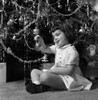 Small girl  holding Christmas bauble Poster Print - Item # VARSAL255416472