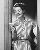 Mature woman reading a letter and smiling Poster Print - Item # VARSAL25549186
