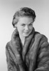 Studio portrait of young woman wearing fur coat Poster Print - Item # VARSAL255422847