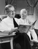 Grandfather reading story to grandson Poster Print - Item # VARSAL2553181