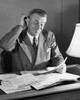 Businessman reading documents in an office Poster Print - Item # VARSAL25548288C