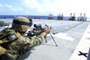 February 15, 2006 - A U.S. Marine adjusts his weapon during a squad automatic weapons live-fire exercise on the flight deck of the amphibious dock landing ship USS Harpers Ferry. Poster Print - Item # VARPSTSTK103097M