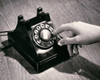 Close-up of a person's hand dialing a number on a rotary telephone Poster Print - Item # VARSAL25518806