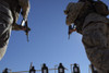 December 5, 2005 - Two Marines change magazines in the midst of firing during the Enhanced Marksmanship Course at Marine Corps Air Station Yuma, Arizona. Poster Print - Item # VARPSTSTK101886M