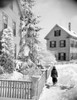 Boy walking down snowy street Poster Print - Item # VARSAL255416160