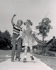 Boy and girl roller-skating Poster Print - Item # VARSAL2554862