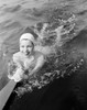 Young woman swimming in lake Poster Print - Item # VARSAL255419229 Young woman swimming in lake Poster Print - Item # VARSAL255419229