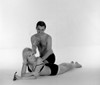 Young man applying suntan lotion on young woman's back Poster Print - Item # VARSAL255417826