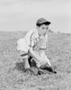 Boy putting on baseball glove Poster Print - Item # VARSAL255422412