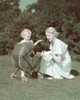 Young woman and her daughter looking at a kitten in a baby stroller Poster Print - Item # VARSAL381019171