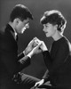 Side profile of a young man putting a ring on a young woman's finger Poster Print - Item # VARSAL2552948A
