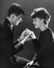 Side profile of a young man putting a ring on a young woman's finger Poster Print - Item # VARSAL2552948A