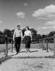 Young happy couple walking and holding hands Poster Print - Item # VARSAL255422147