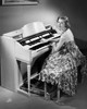Young woman playing a piano Poster Print - Item # VARSAL2553356B
