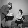 Young woman receiving presents from young man Poster Print - Item # VARSAL255418055