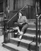 Teenage girl sitting on steps and looking upset Poster Print - Item # VARSAL25517500