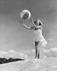 Young woman playing with beach ball Poster Print - Item # VARSAL25521147B