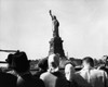 Tourists looking at a statue  Statue of Liberty  New York City  New York  USA Poster Print - Item # VARSAL2554331