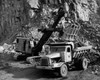 Earth mover loading rocks in to a dump truck Poster Print - Item # VARSAL25538277