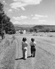 Rear view of two girls walking together on a road Poster Print - Item # VARSAL25516339
