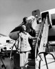 Young woman with a young man standing on a staircase of an airplane Poster Print - Item # VARSAL25544358