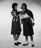 Two schoolgirls looking at book Poster Print - Item # VARSAL255417555