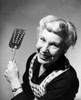 Portrait of a senior woman holding a spatula Poster Print - Item # VARSAL25511584