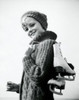 Portrait of a teenage girl carrying a pair of ice skates Poster Print - Item # VARSAL25517272B