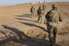 November 2, 2011 - U.S. Army soldiers walk toward Checkpoint 64 near Loy Karez, Kandahar province, Afghanistan to meet with local leaders, Poster Print - Item # VARPSTSTK105295M