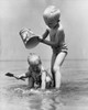 Boy and girl playing in water Poster Print - Item # VARSAL255899