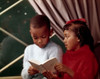 Close-up of a boy reading a book with his sister Poster Print - Item # VARSAL3811362191